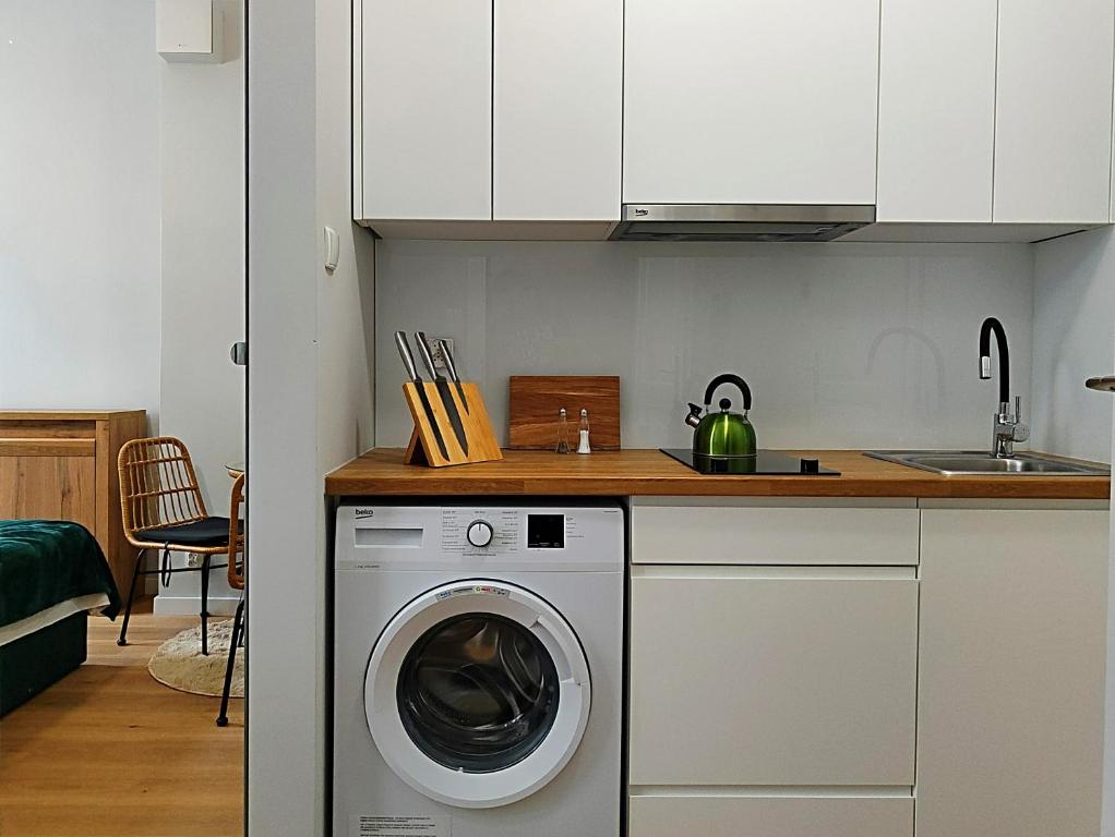 Kuchyň nebo kuchyňský kout v ubytování Hugo Eden Apartments