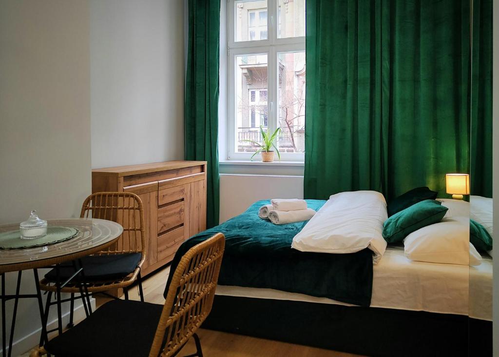 Postel nebo postele na pokoji v ubytování Hugo Eden Apartments