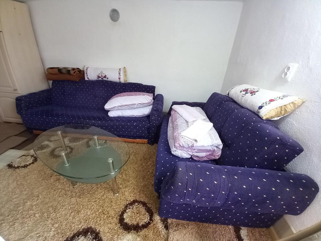 a living room with a couch and a table at Kuca za odmor-P- in Visoko