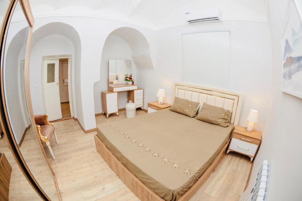 En eller flere senge i et værelse på Villa Belle in Tashkent City