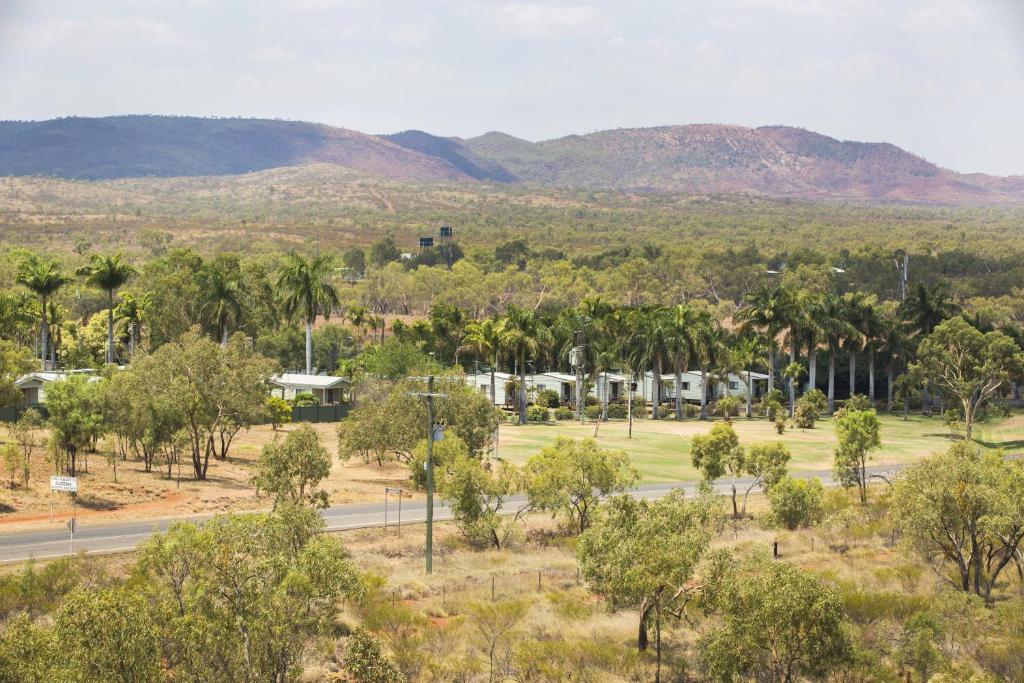 an aerial view of a park with palm trees and a road at Discovery Parks - Argylla in Mount Isa