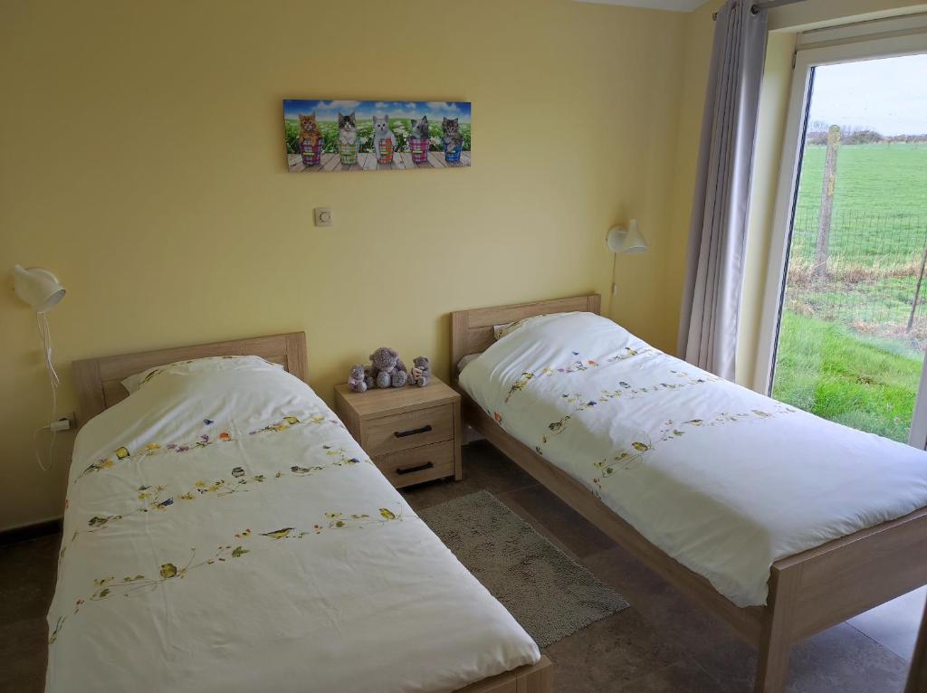 Postel nebo postele na pokoji v ubytování B&B Het Polderhof