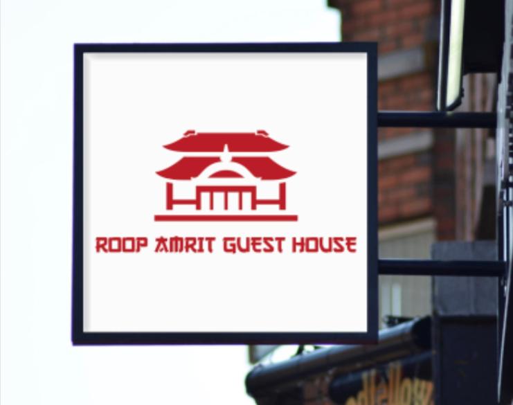 a sign for a roofant crust house on a building at ROOP AMRIT GUEST HOUSE in Agartala