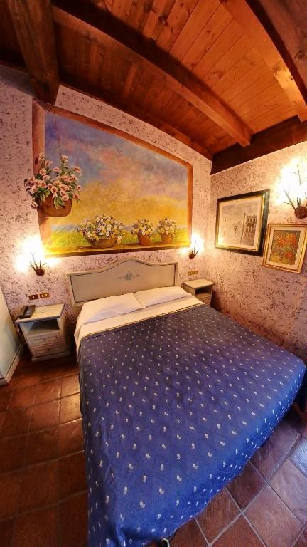 Postel nebo postele na pokoji v ubytování Hotel Bolero