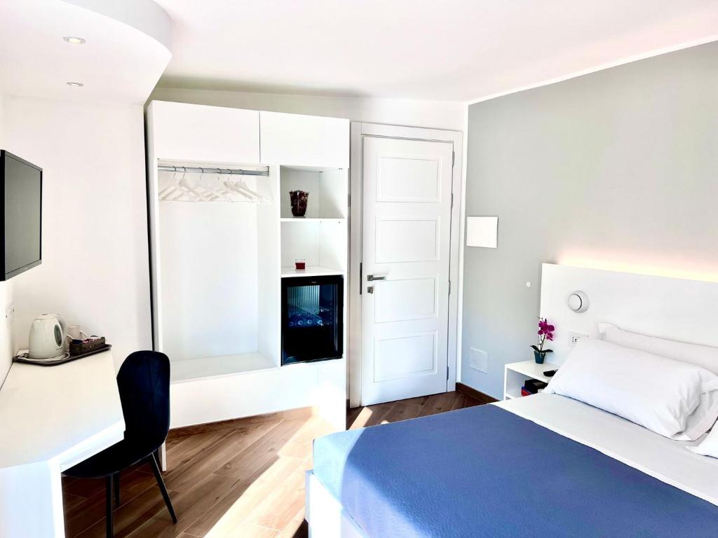 A bed or beds in a room at Tropea Il Tridente Accommodations