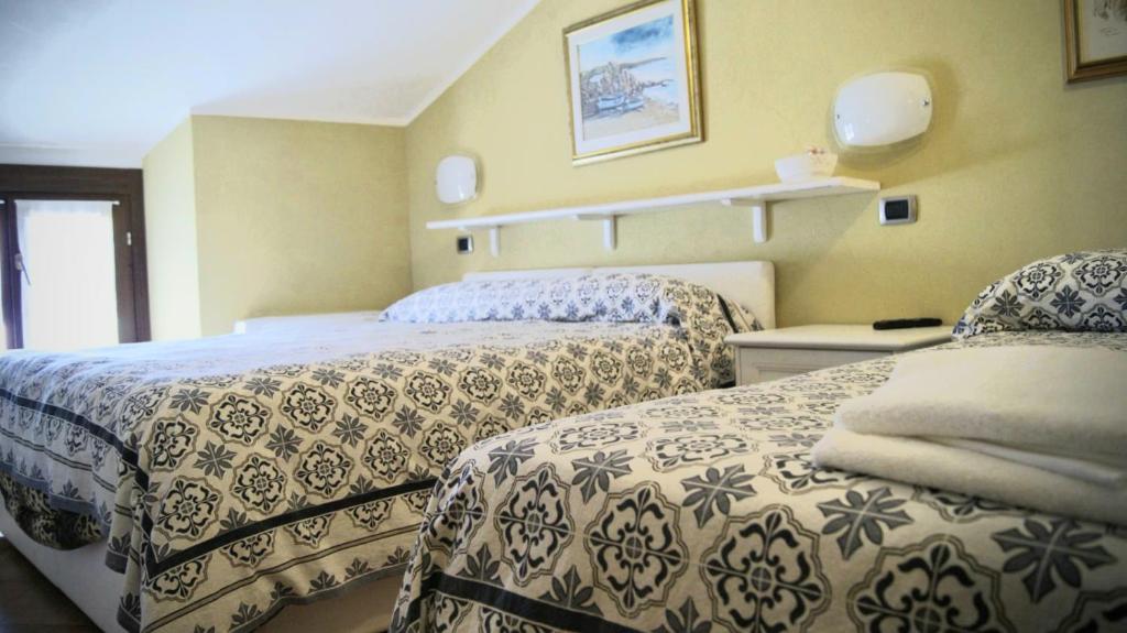 Postel nebo postele na pokoji v ubytování affittacamere la loggia
