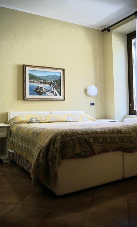 Postel nebo postele na pokoji v ubytování affittacamere la loggia