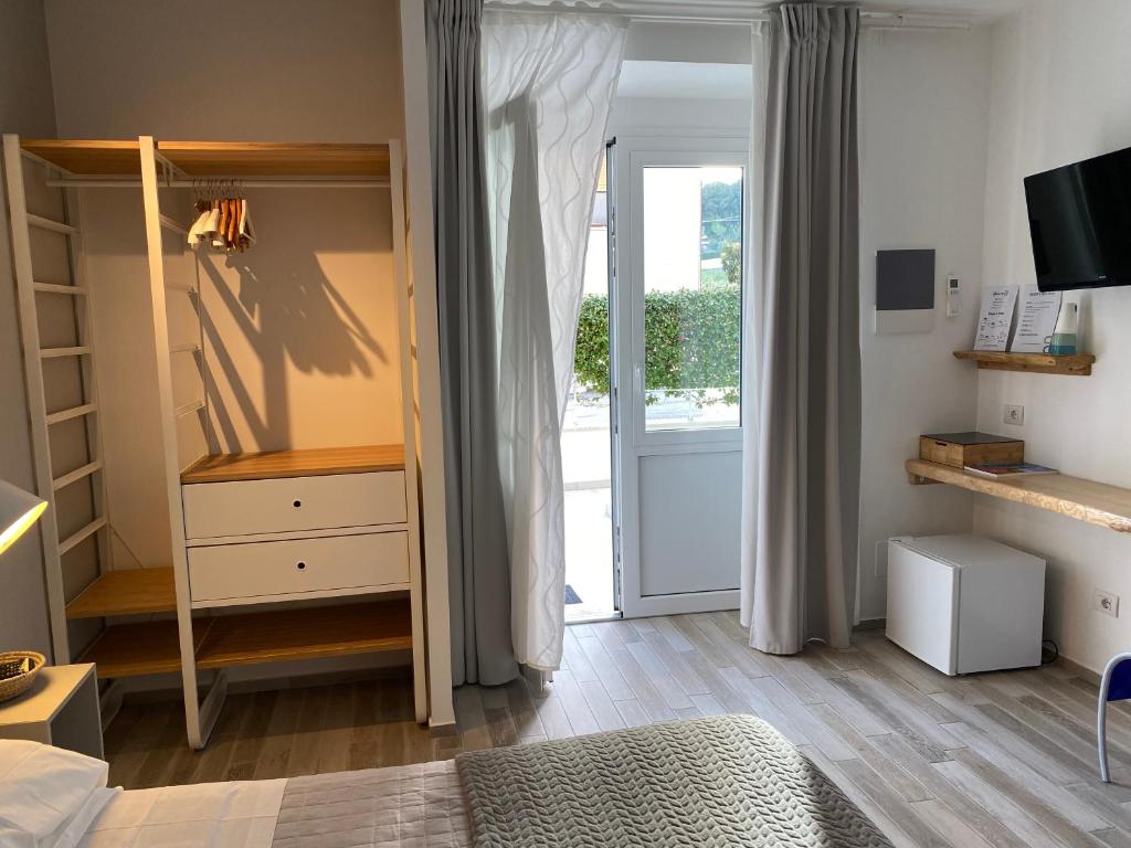 TV a/nebo společenská místnost v ubytování B&B 125Metri sul mare