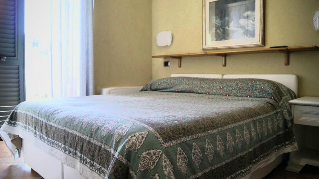 Postel nebo postele na pokoji v ubytování affittacamere la loggia