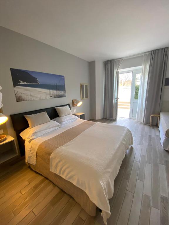 Postel nebo postele na pokoji v ubytování B&B 125Metri sul mare