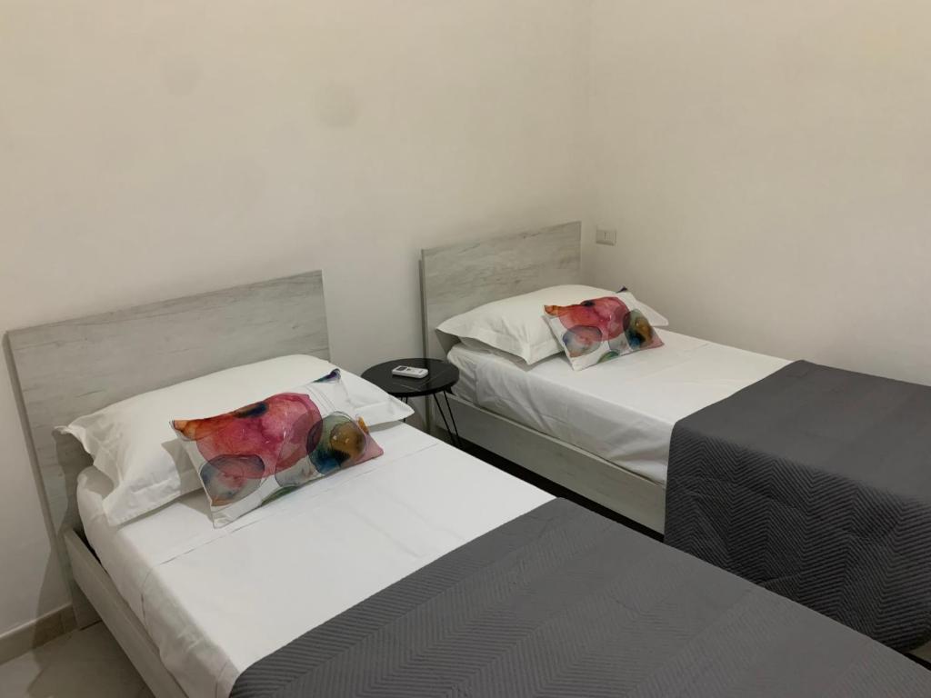A bed or beds in a room at CASA VACANZE VIA CASALE