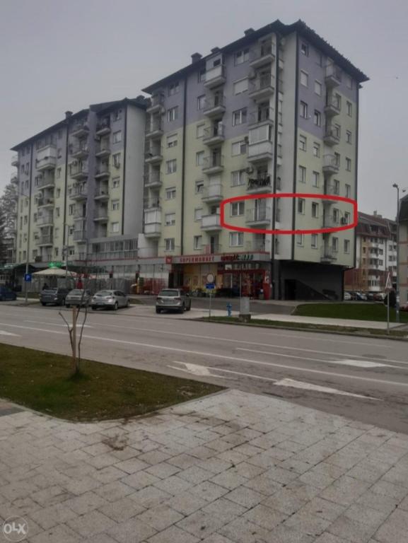 a large building on the side of a street at Apartman Romana in Doboj