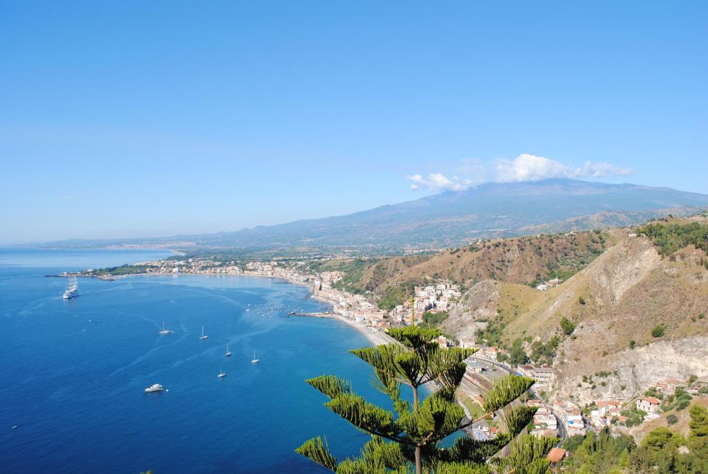 a view of a bay with boats in the water at Tiziana in Giardini Naxos