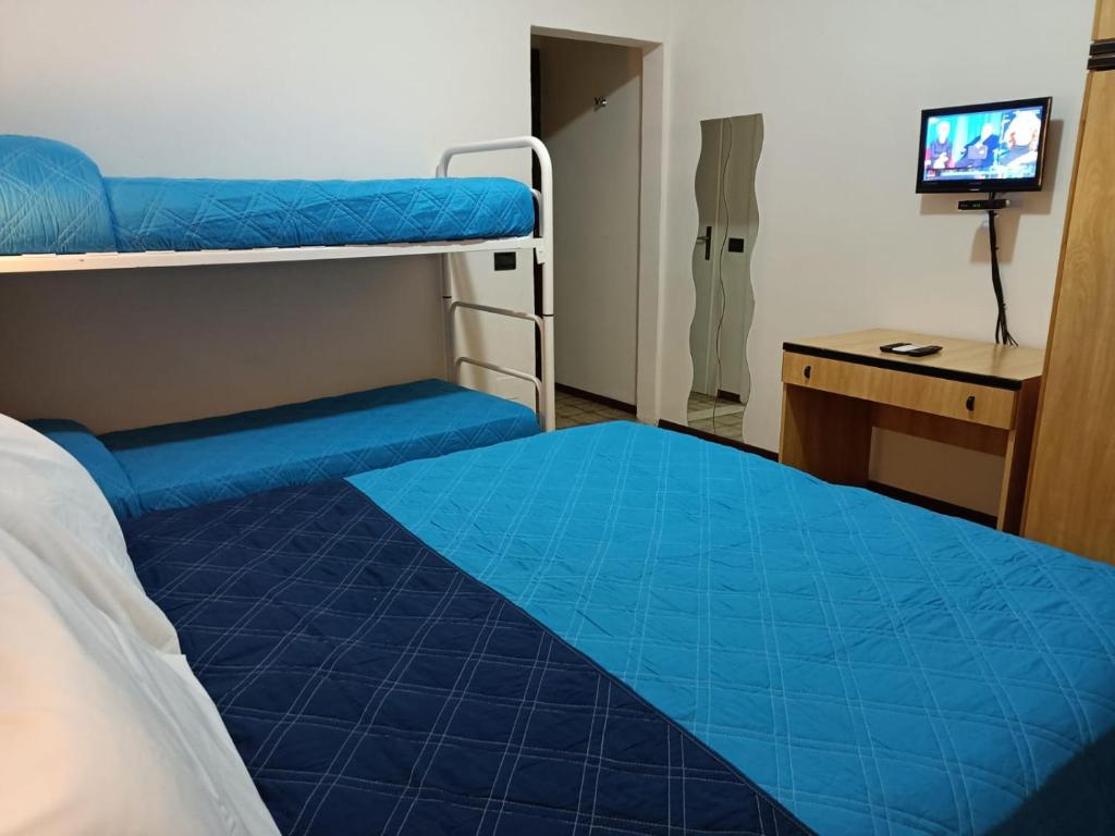 Postel nebo postele na pokoji v ubytování Hotel La Torre