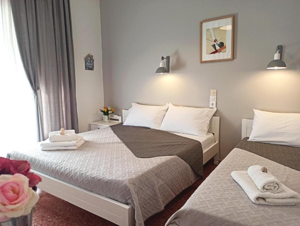 Postel nebo postele na pokoji v ubytování Apartments Papadioti