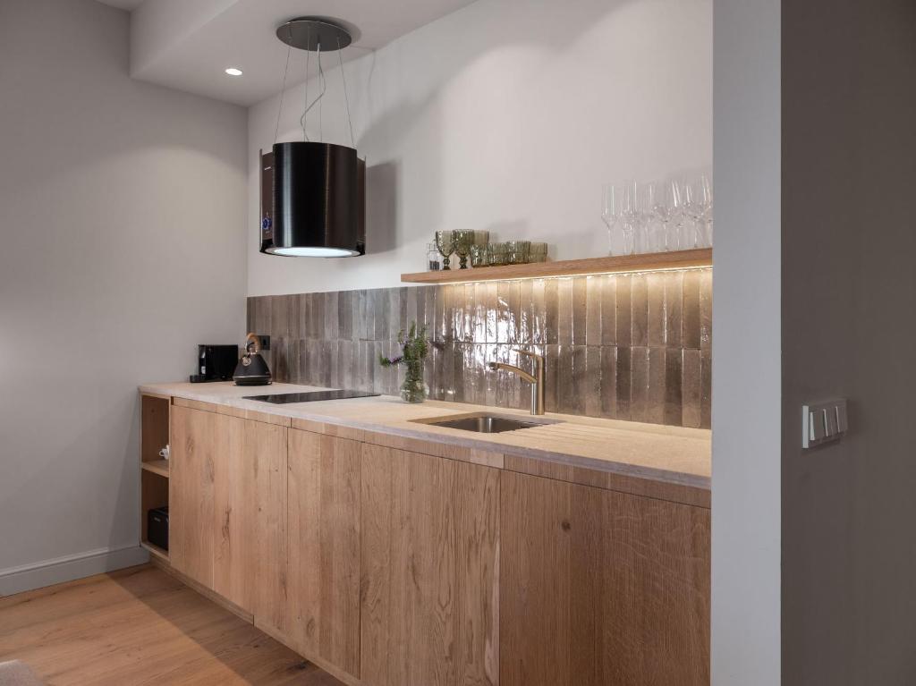 Kuchyň nebo kuchyňský kout v ubytování Can Verí Suites