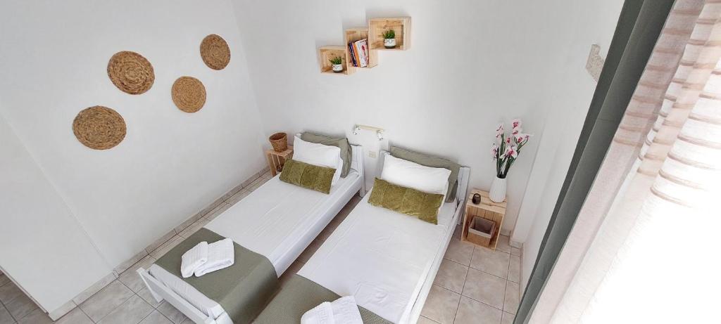 Postel nebo postele na pokoji v ubytování Kato Yialos Paros