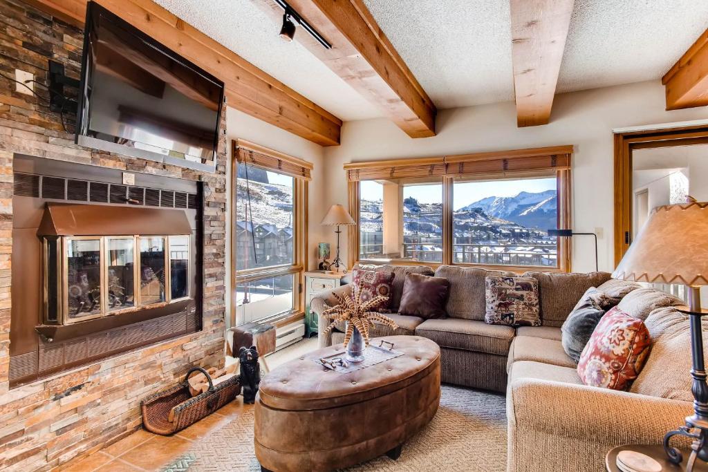 a living room with a couch and a fireplace at 2 Br 2Ba Spacious Condo With A Fireplace Condo in Crested Butte