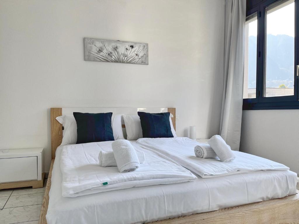 Postel nebo postele na pokoji v ubytování GuestHouse Lugano Apartments by LR