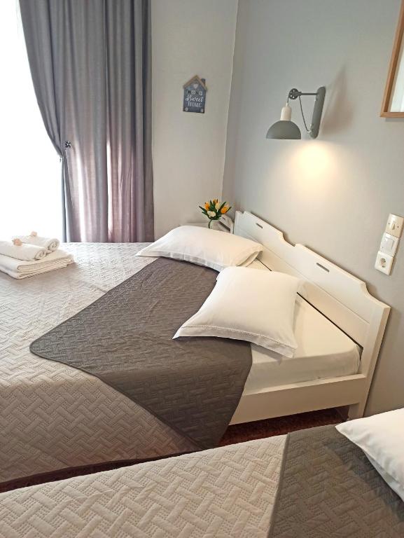 Postel nebo postele na pokoji v ubytování Apartments Papadioti