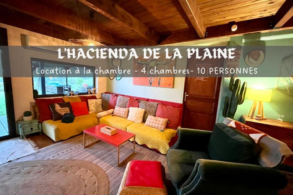 a living room with a yellow couch and chairs at L'Hacienda de la plaine in Le Tampon