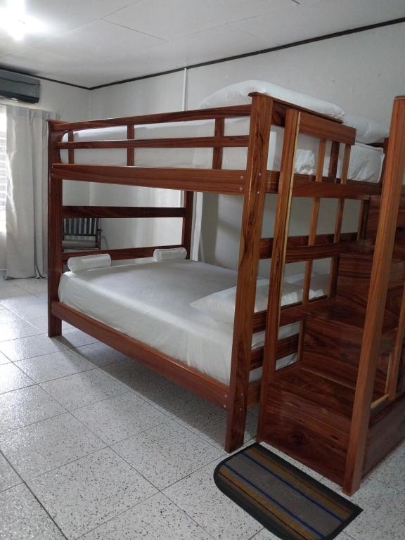 a couple of bunk beds in a room at Apartamento AMUEBLADO in Canoas