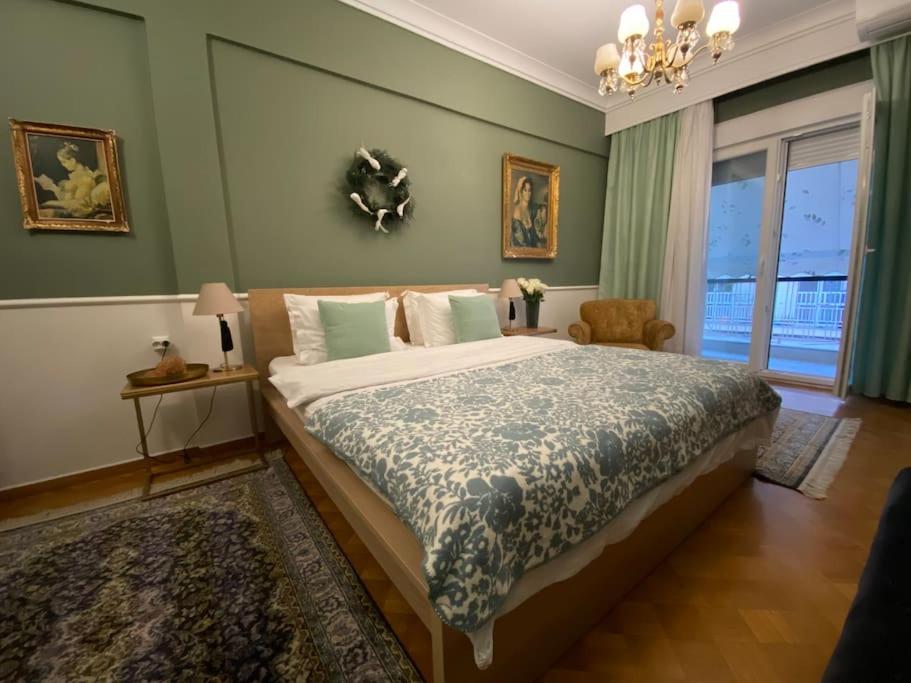 a bedroom with a large bed and a window at Sweet Home Serres premium living in Serres