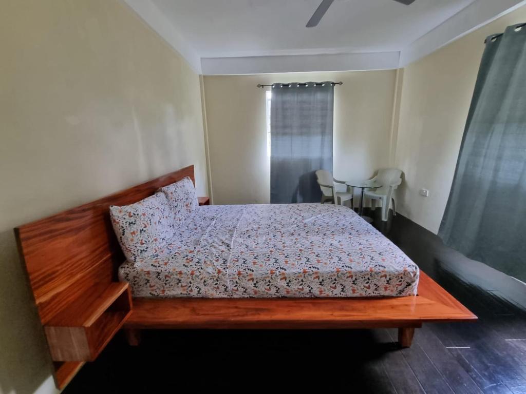 Postel nebo postele na pokoji v ubytování Tropical Suites