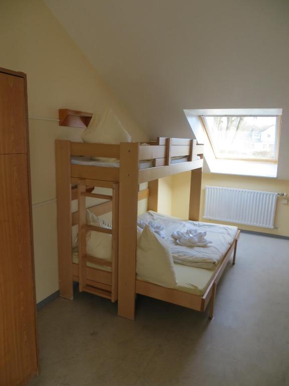 Postel nebo postele na pokoji v ubytování Jugendherberge Kappeln