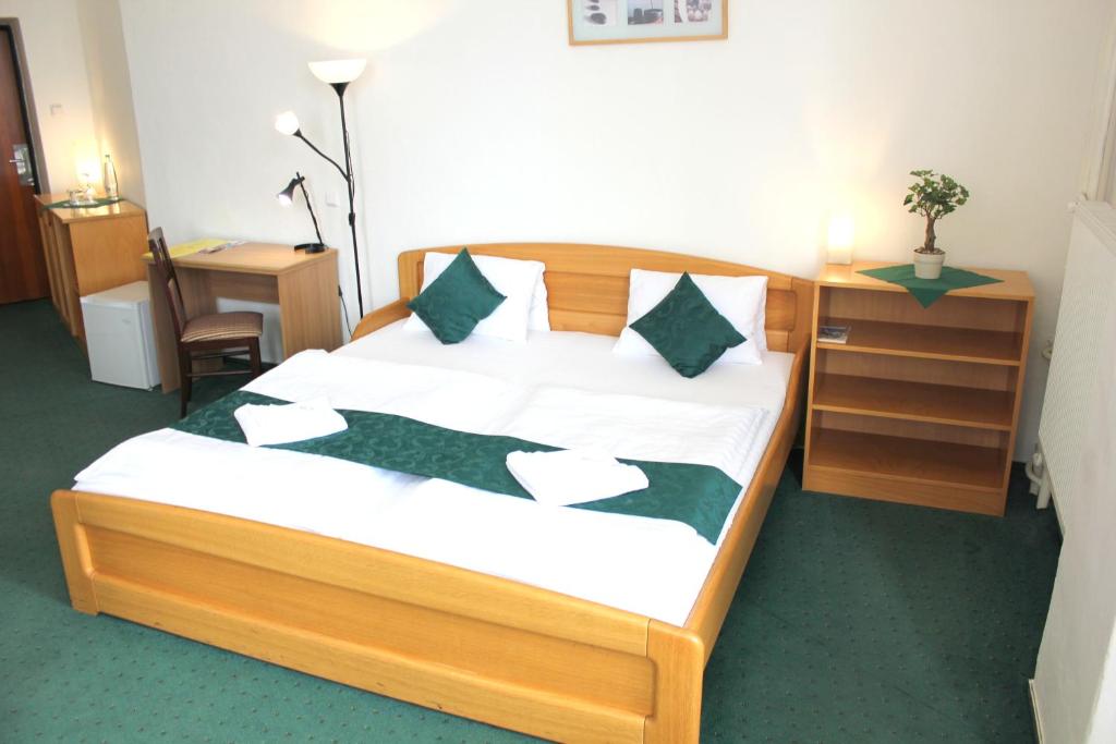 Postel nebo postele na pokoji v ubytování Hotel Central