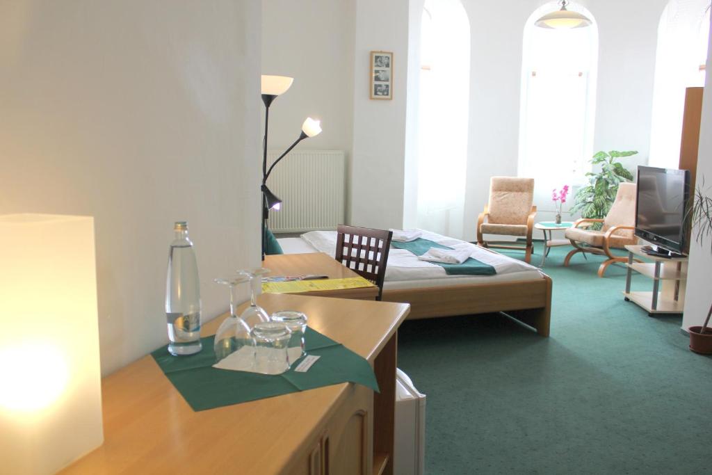 Postel nebo postele na pokoji v ubytování Hotel Central
