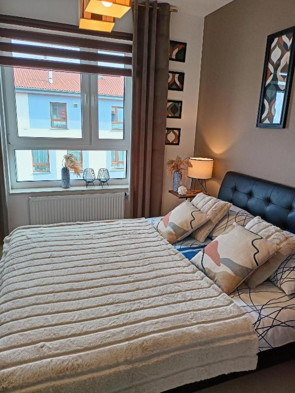 Posteľ alebo postele v izbe v ubytovaní Apartament z garażem blisko dwóch jezior na Warmii i Mazurach