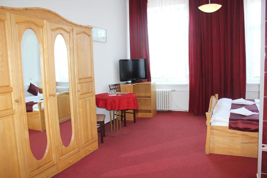 Postel nebo postele na pokoji v ubytování Hotel Central