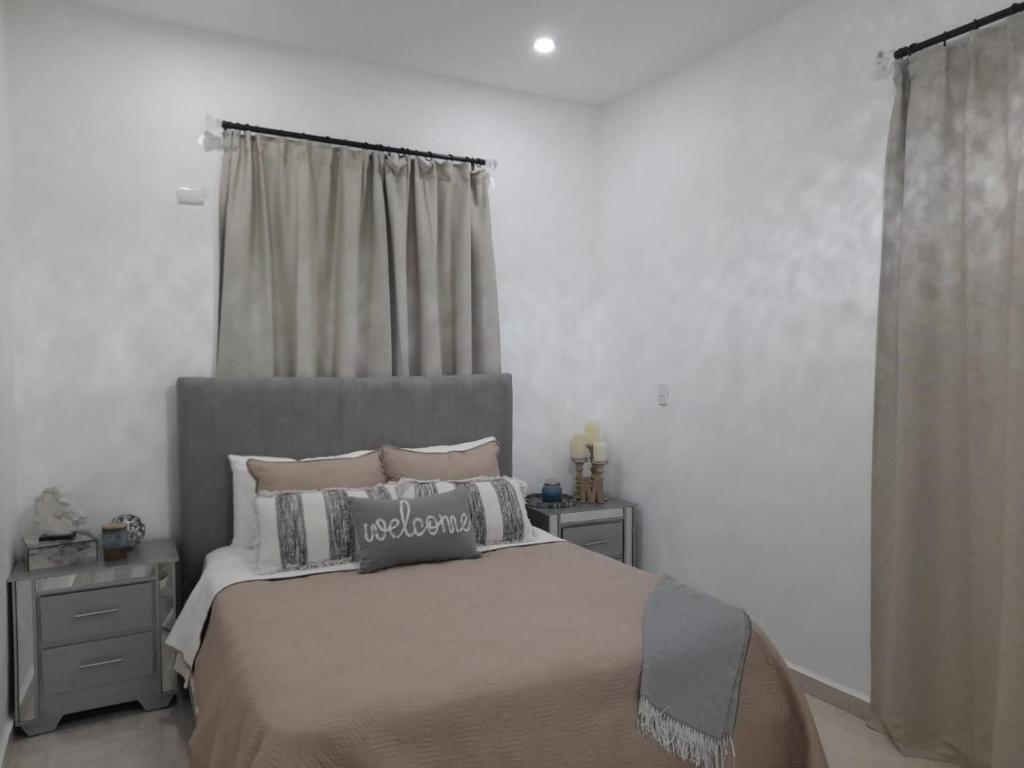 Postel nebo postele na pokoji v ubytování Villa Mónaco Jarabacoa RD