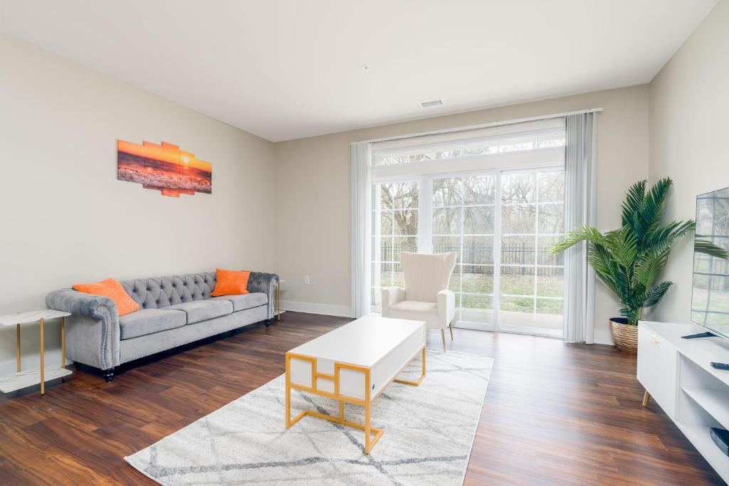 a living room with a couch and a table at Stylish 1BR in at the Crossing in Indianapolis
