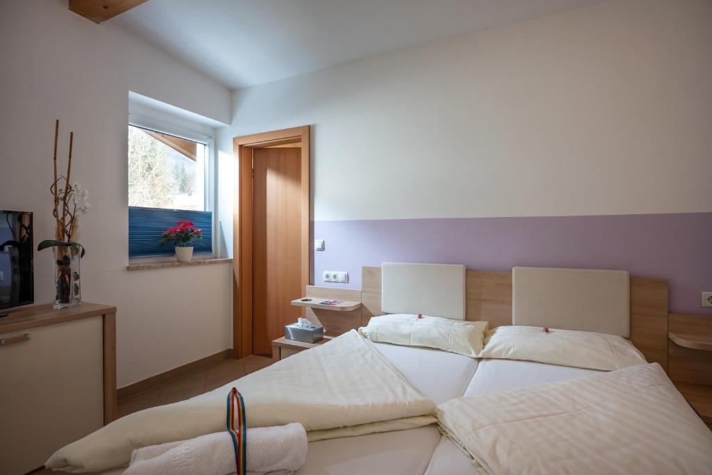 Postel nebo postele na pokoji v ubytování Blaiken Appartements in Scheffau am Wilden Kaiser