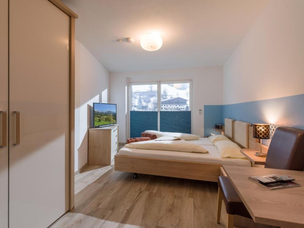 Postel nebo postele na pokoji v ubytování Blaiken Appartements in Scheffau am Wilden Kaiser