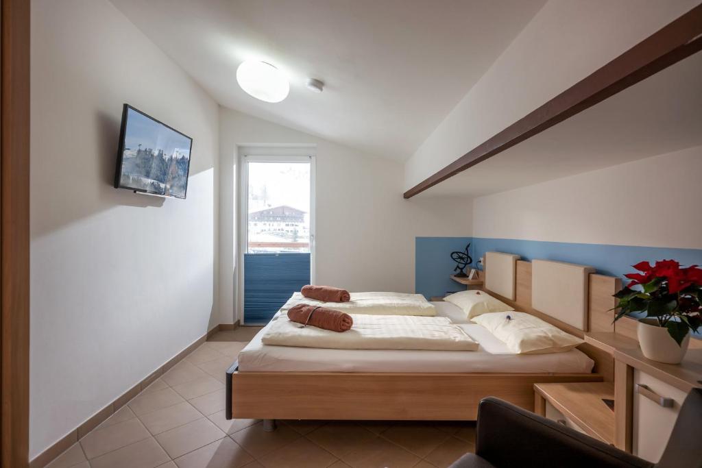 Postel nebo postele na pokoji v ubytování Blaiken Appartements in Scheffau am Wilden Kaiser