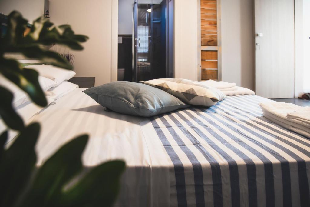 Postel nebo postele na pokoji v ubytování Homiday - Bel Salento Specchia Guest house