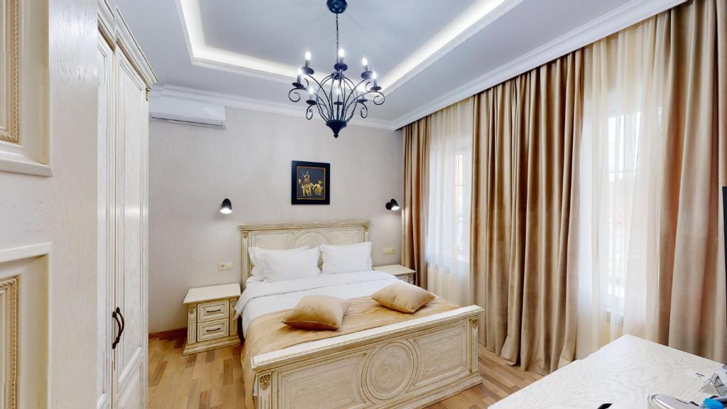 Postel nebo postele na pokoji v ubytování Aspar Boutique Hotel