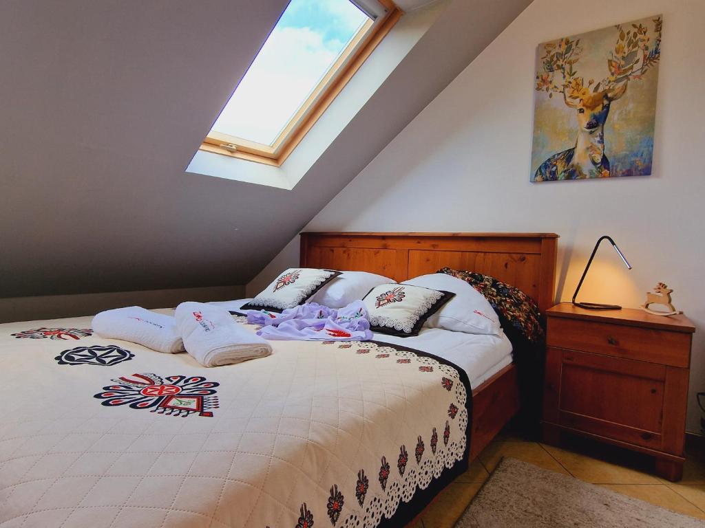 Posteľ alebo postele v izbe v ubytovaní Apartament Butorowy Kościelisko