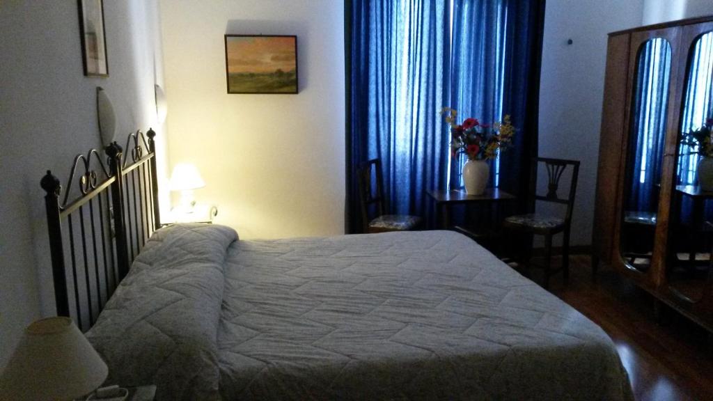 Postel nebo postele na pokoji v ubytování Camere Carli