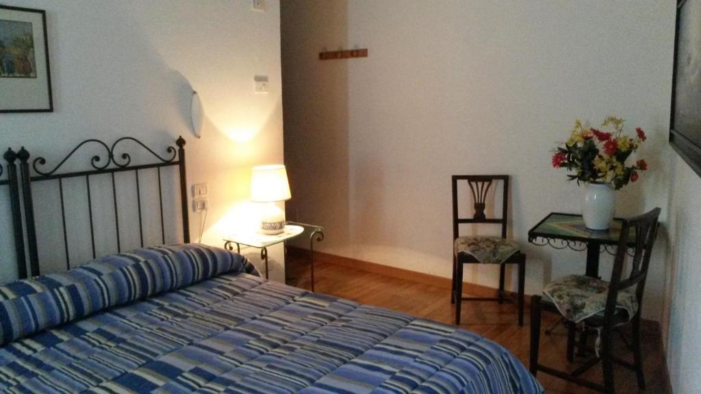 Postel nebo postele na pokoji v ubytování Camere Carli