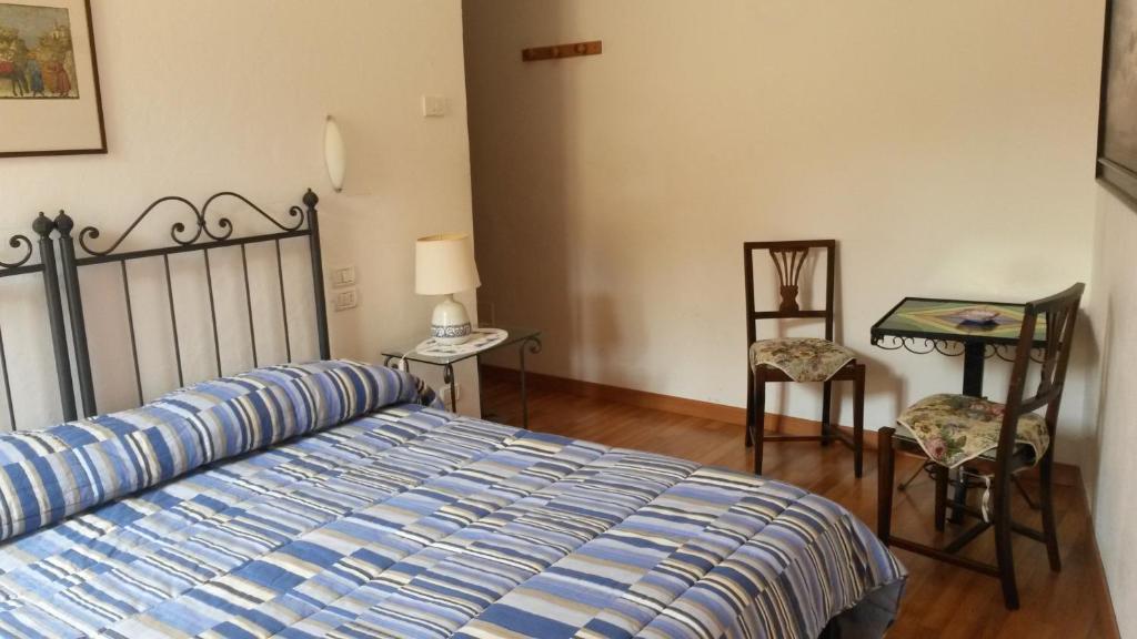 Postel nebo postele na pokoji v ubytování Camere Carli