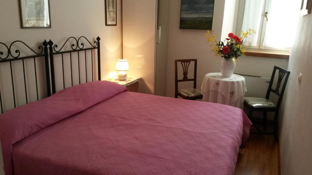 Postel nebo postele na pokoji v ubytování Camere Carli