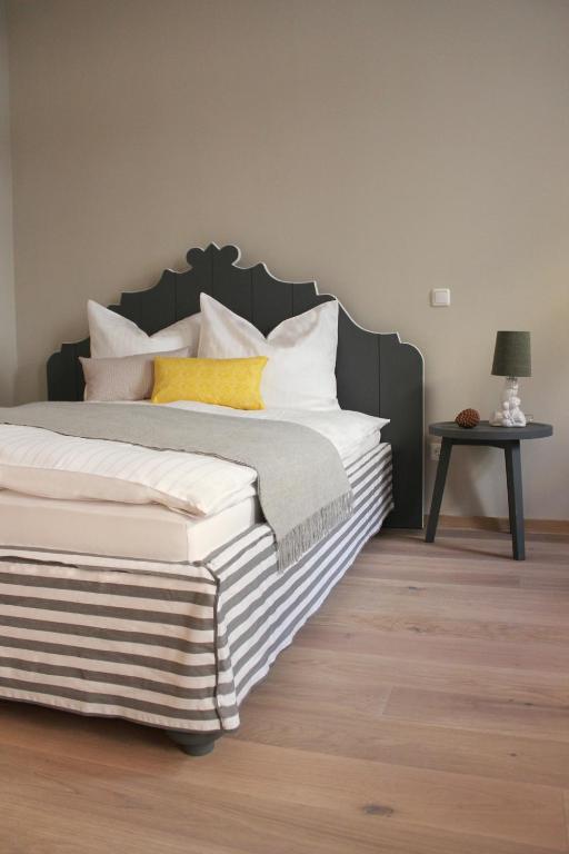 Postel nebo postele na pokoji v ubytování Hotel Stadthaus