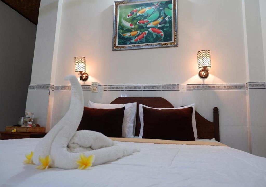 Postel nebo postele na pokoji v ubytování Danasari Homestay