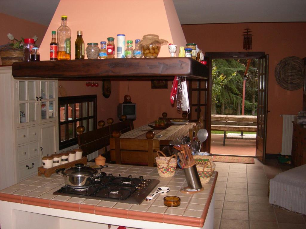 Kuchyň nebo kuchyňský kout v ubytování B&B Rollo Garden