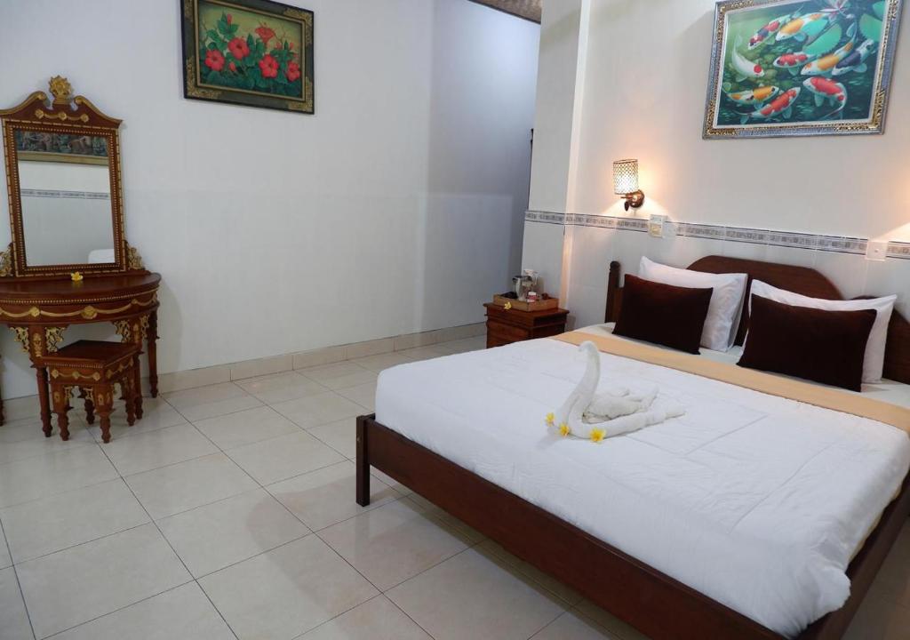 Postel nebo postele na pokoji v ubytování Danasari Homestay