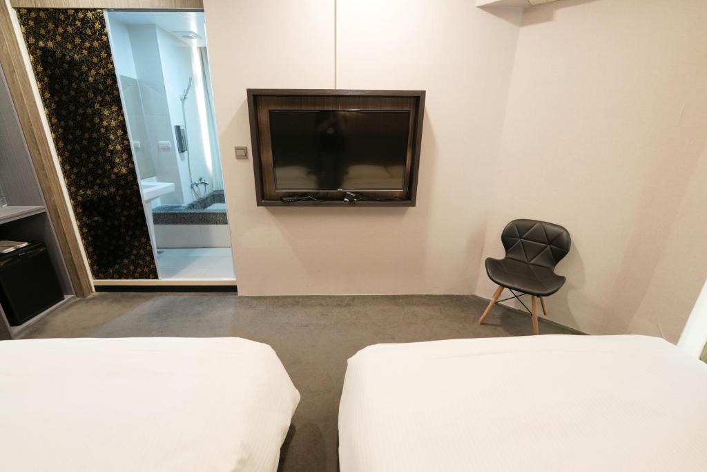 TV a/nebo společenská místnost v ubytování Meworld Hotel - Ximen